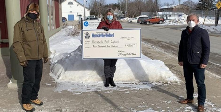 Mayor Doug Struthers (right) presents RCHS CEO Michele Bellows (middle) and RCHS Board member Terry Gilhen (left) with $4,500 cheque from the Village.